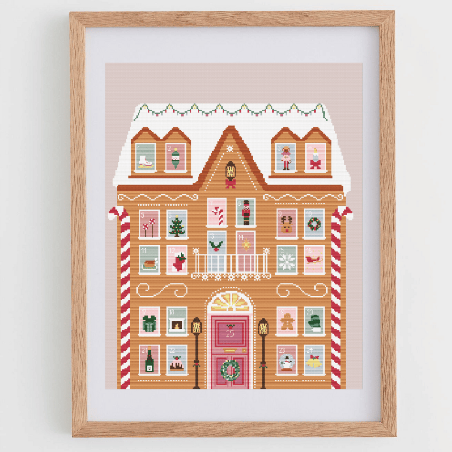 Adevent calendar cross stitch pattern with a gingerbread house and different Christmas details in each window | Christmas cross stitch charts