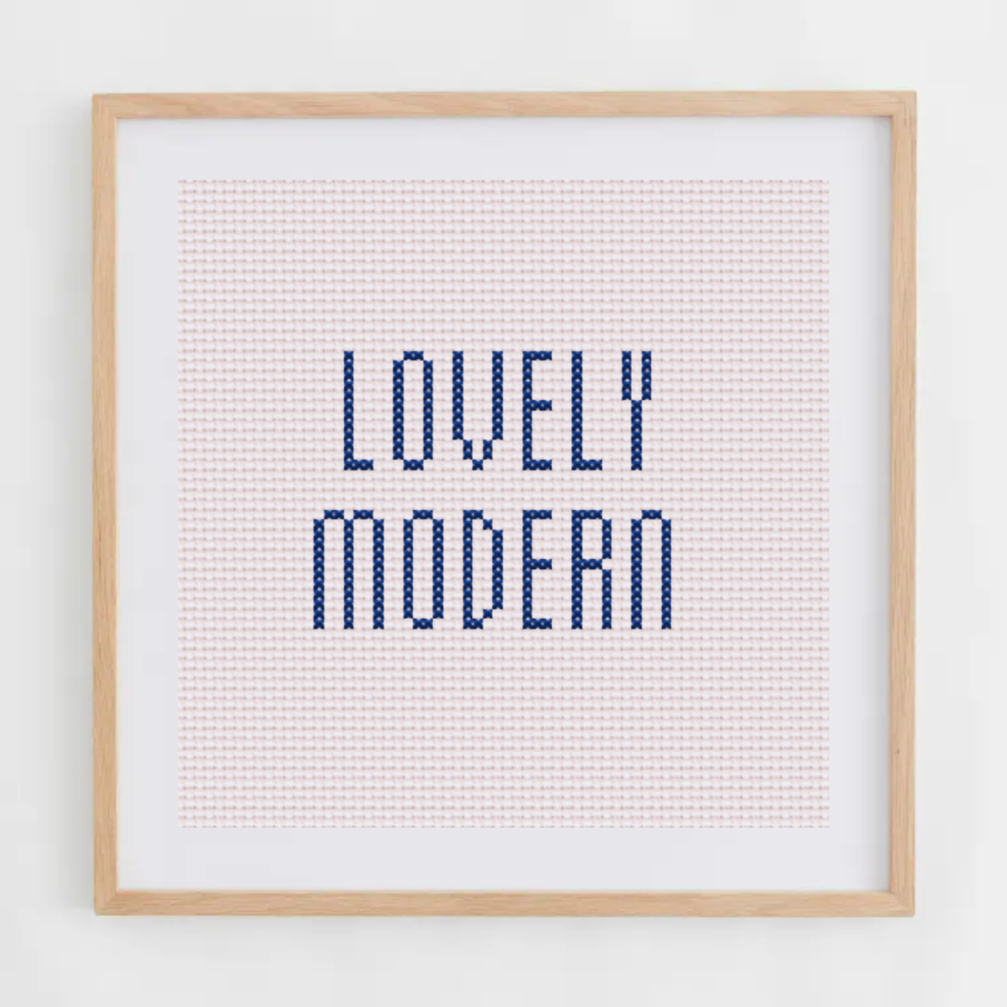 Lovely Modern alphabet cross-stitch pattern. Small elongated cross stitch chart font, including letters, numbers, and symbols.
