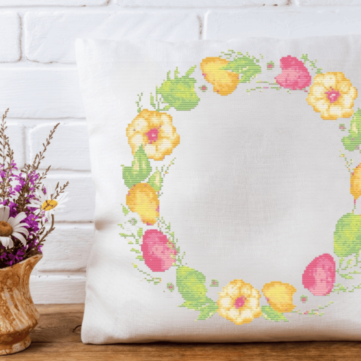Pink Easter wreath cross-stitch pattern with a wreath made of Easter eggs and flowers | Easter cross stitch charts | Modern and pretty cross stitch ideas