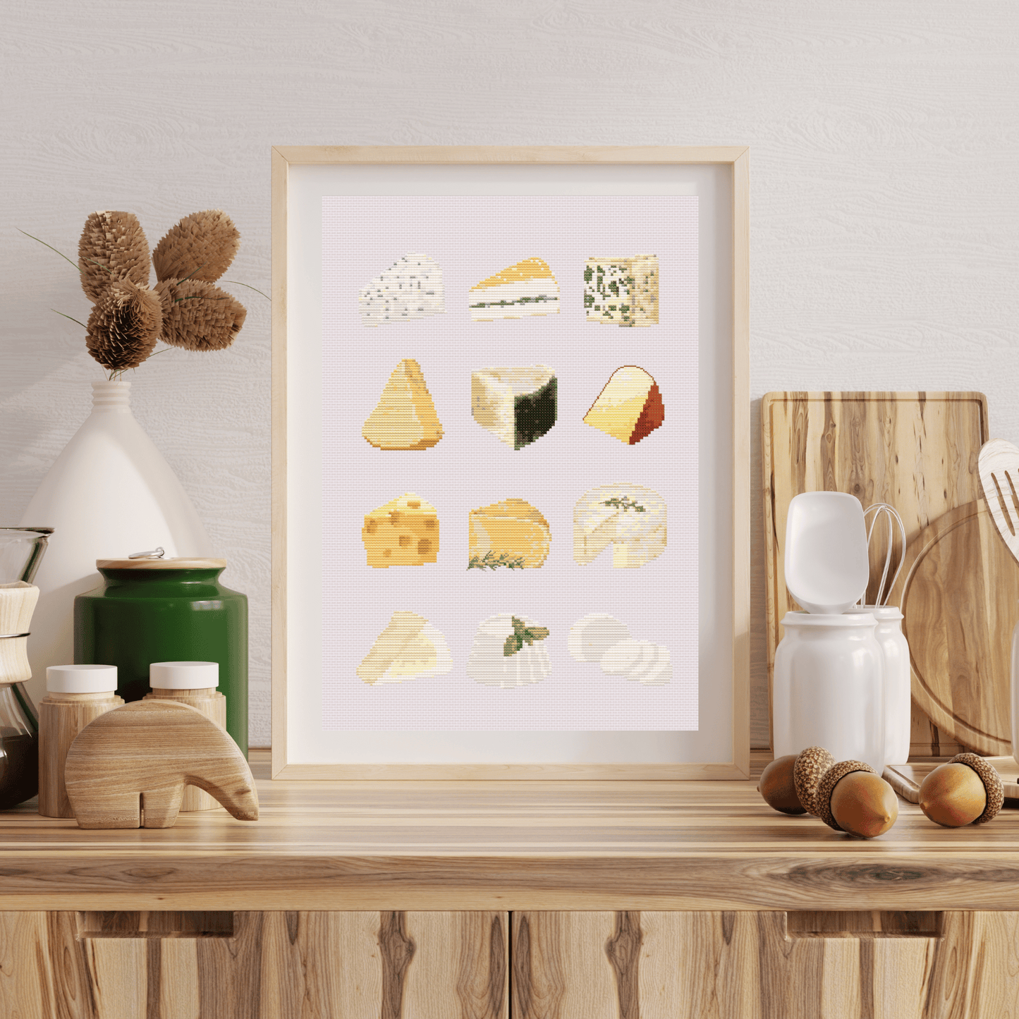 Cheese cross-stitch pattern with different types of cheese. Use this cross stitch chart to personalize an apron, a tea towel, or to create a kitchen poster. Download now!