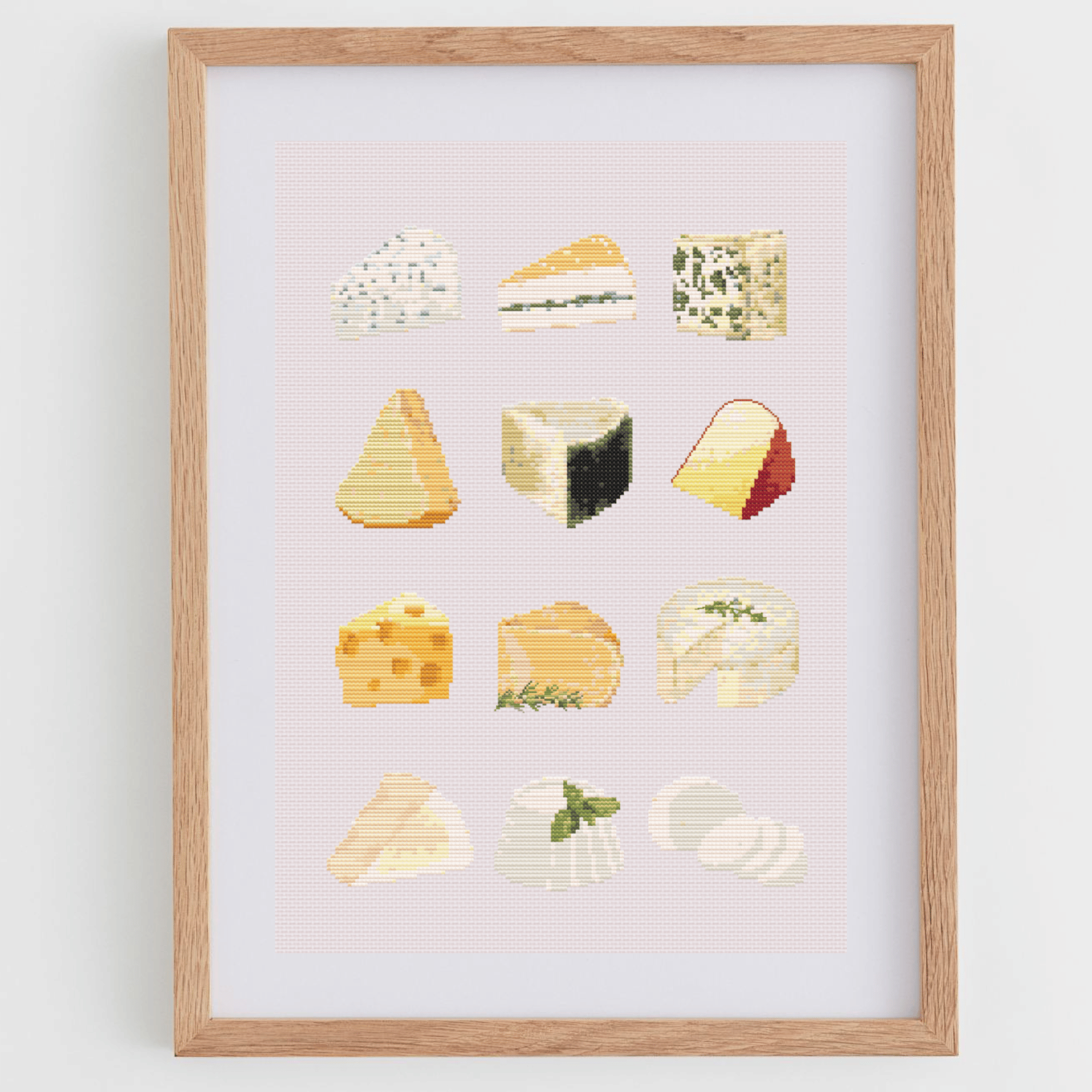 Cheese cross-stitch pattern with different types of cheese. Use this cross stitch chart to personalize an apron, a tea towel, or to create a kitchen poster. Download now!