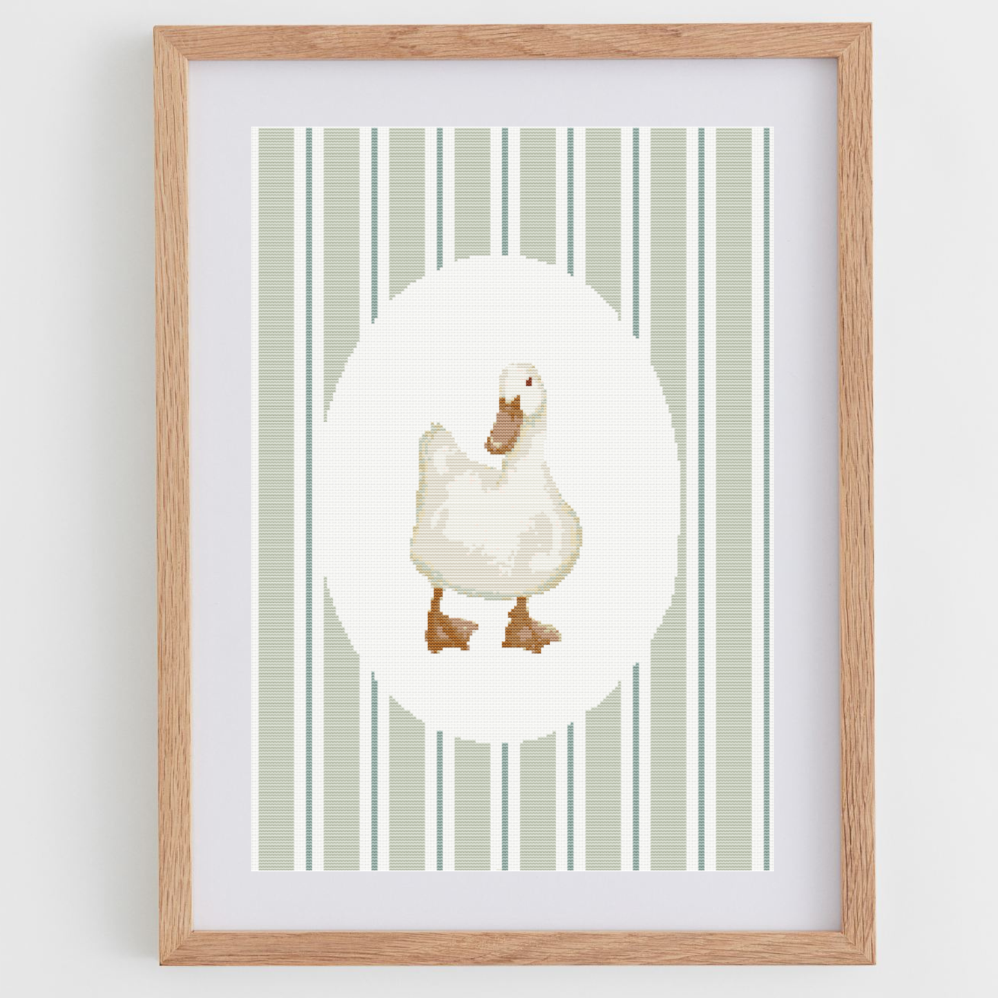 Duck cross-stitch pattern, in a portrait shape, perfect for a nursery or baby room.