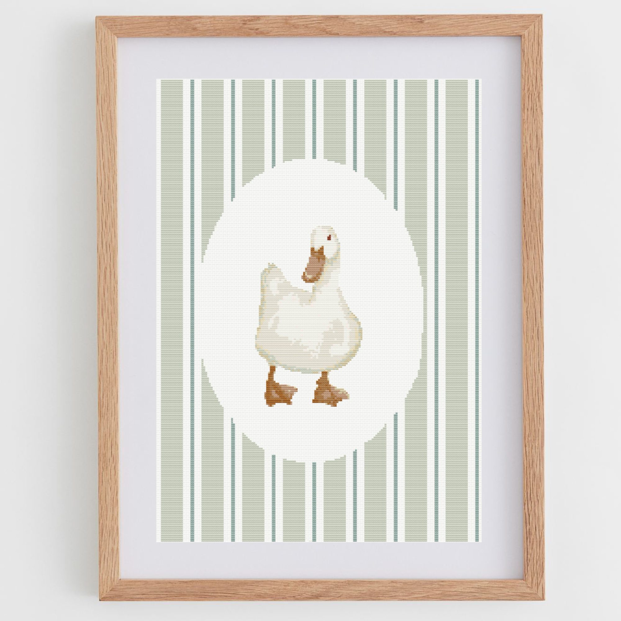 Duck cross-stitch pattern, in a portrait shape, perfect for a nursery or baby room.