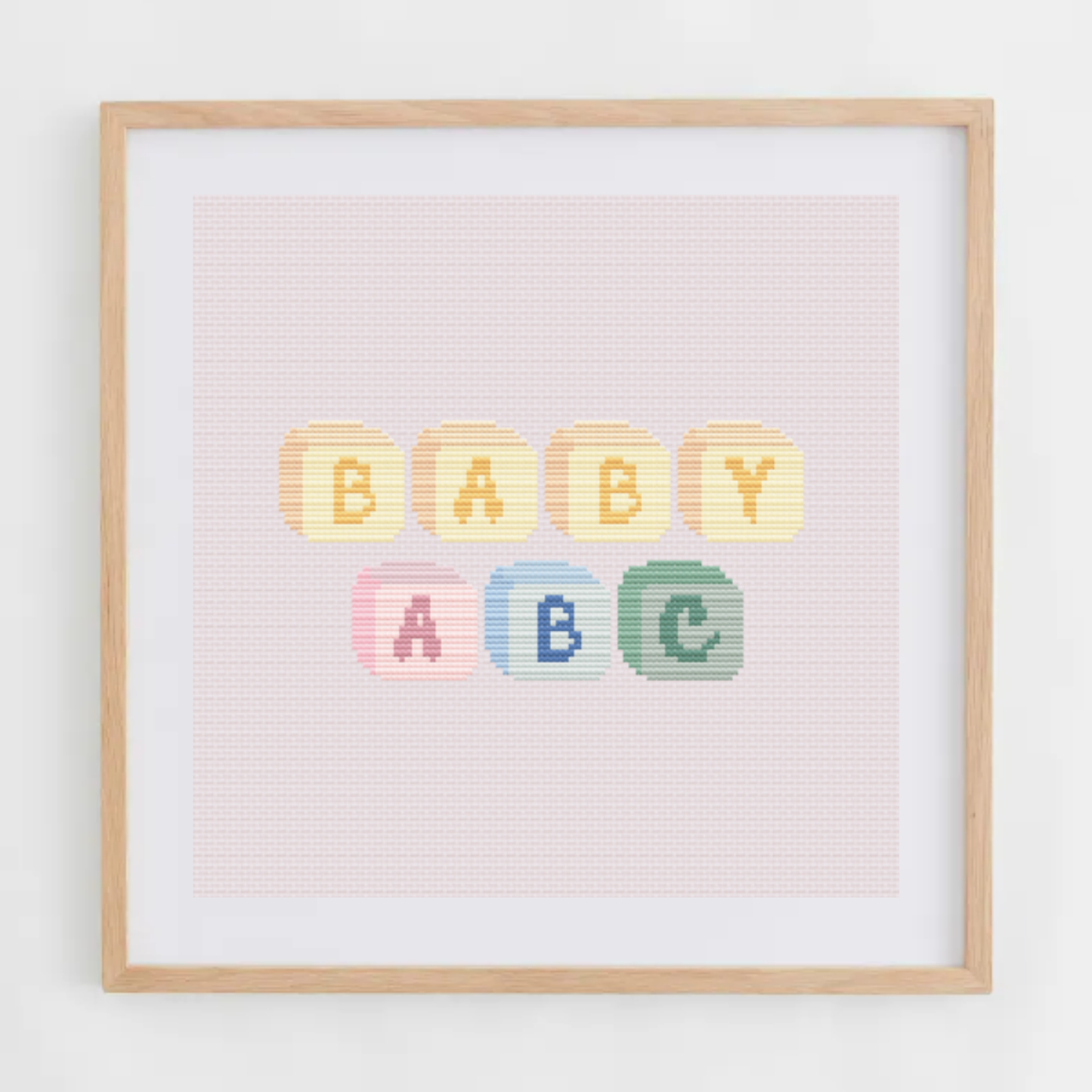 Baby ABC alphabet cross-stitch pattern. Medium cross stitch chart font made of baby cubes, including letters, numbers, and symbols.