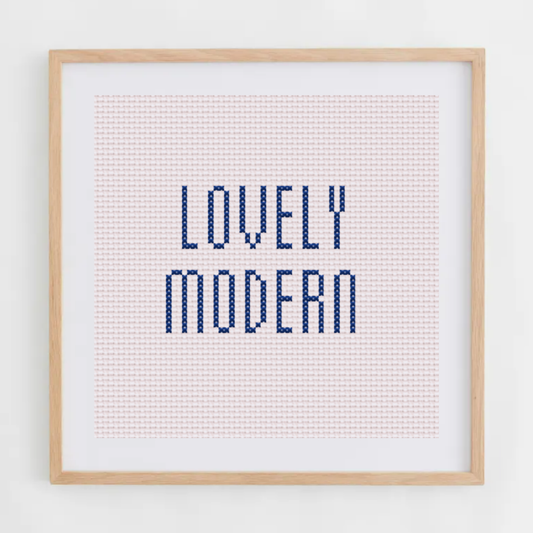 Lovely Modern alphabet cross-stitch pattern. Small elongated cross stitch chart font, including letters, numbers, and symbols.