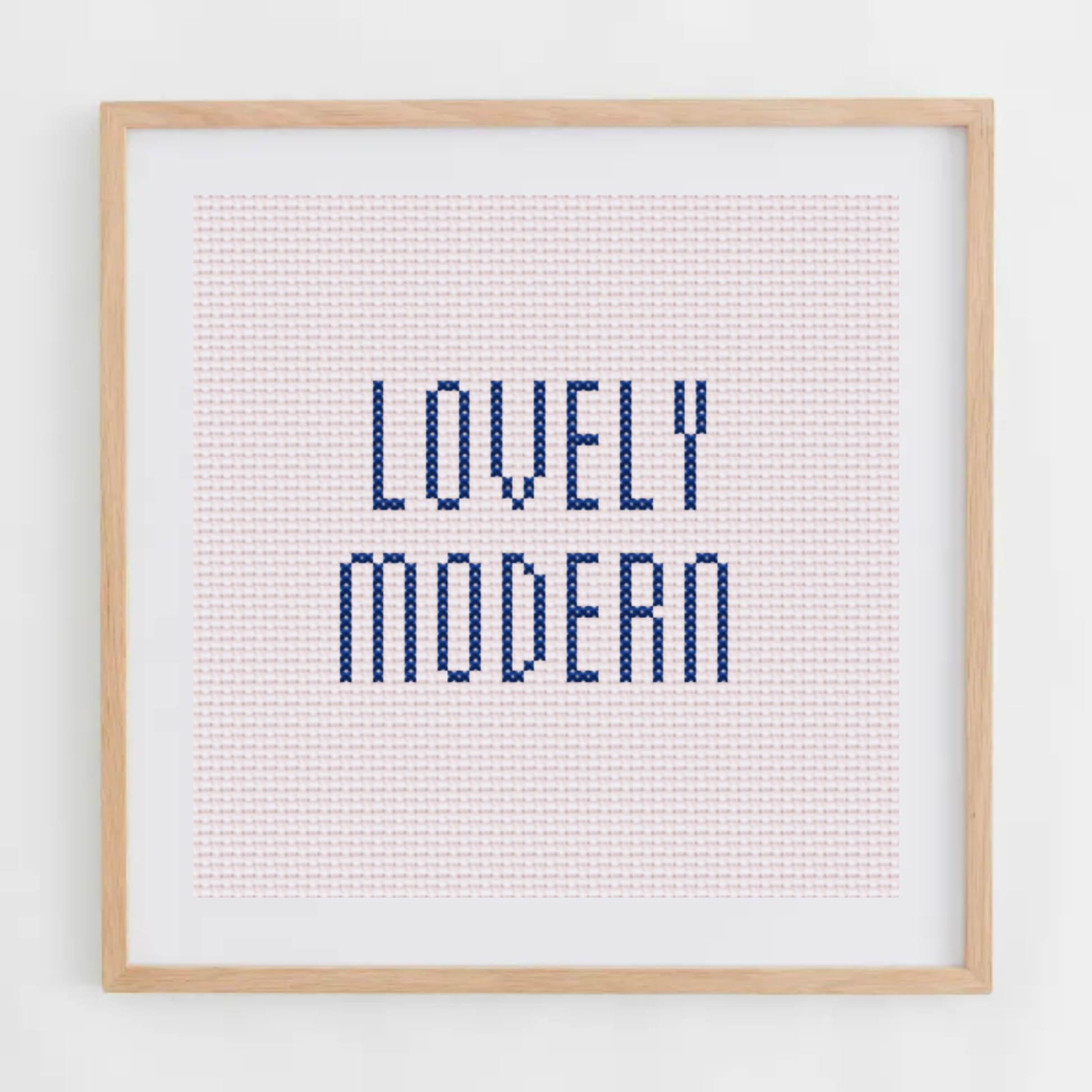 Lovely Modern alphabet cross-stitch pattern. Small elongated cross stitch chart font, including letters, numbers, and symbols.
