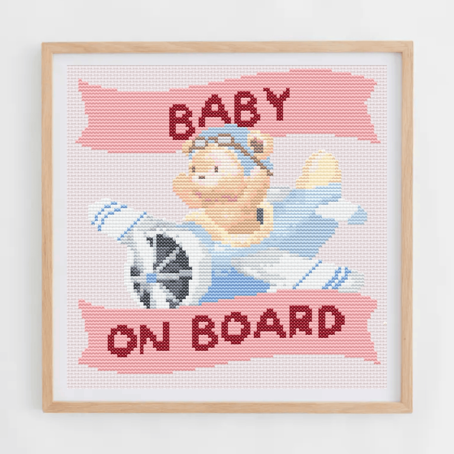 Baby on board sign cross-stitch pattern for your car, with a teddy bear on a plane