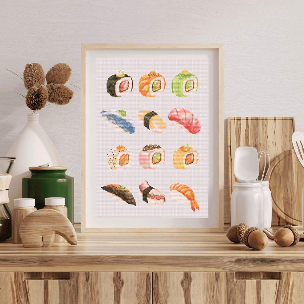 Sushi cross-stitch pattern with sushi rolls and sashimi. Use this cross stitch chart to personalize an apron, a tea towel, or to create a kitchen poster. Download now!